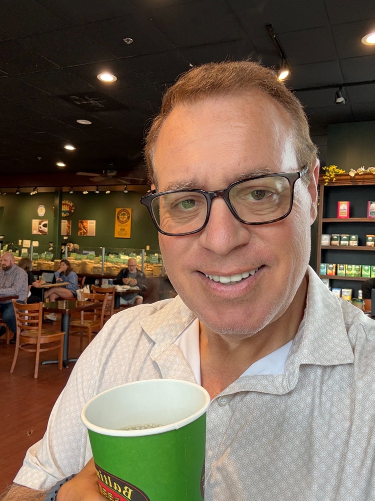 Chris, founder of Tech Latte, with a coffee